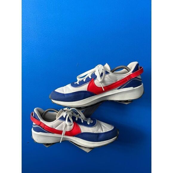 - Nike Waffle Debut Swoosh Old Royal Habanero Red is size 9.5